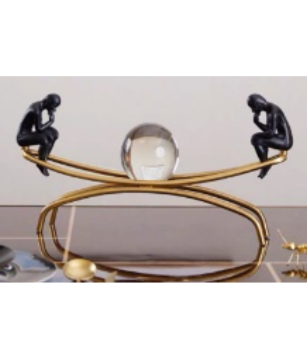 Figurine Sculpture On Seesaw